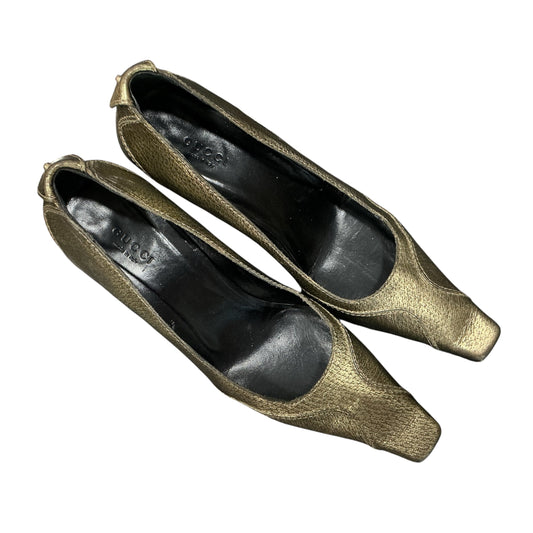 GUCCI GOLD HORSE BIT PUMPS